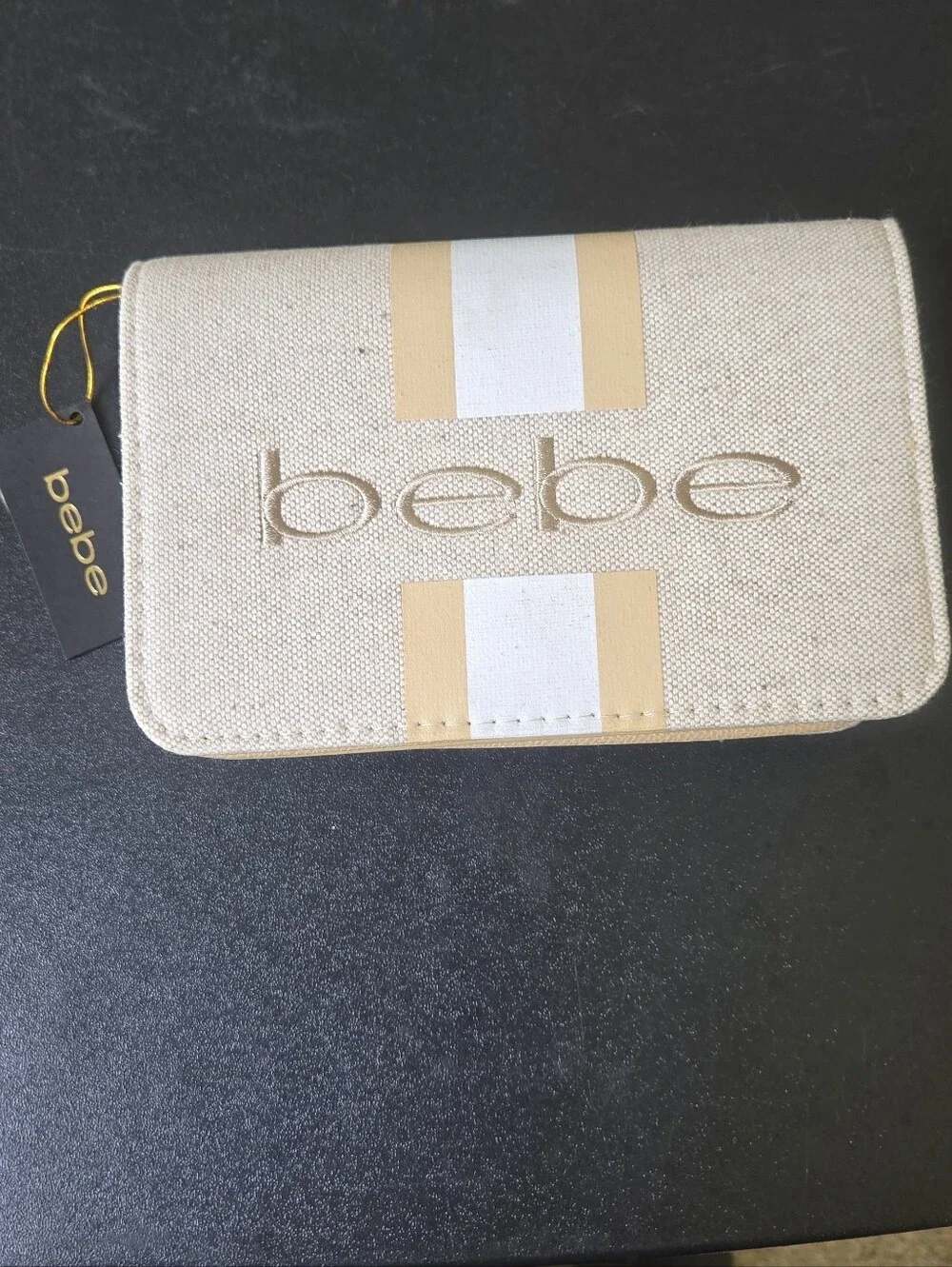 bebe Almond Canvas Crossbody Bag with Gold-Trim Stripe